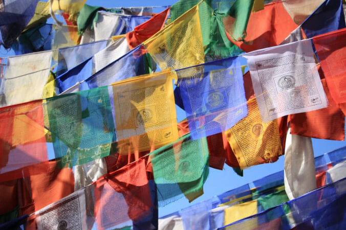 Mantra on the flag and what does it means